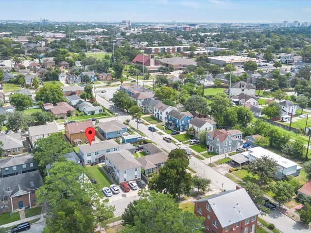 an aerial view of a city with lots of residential buildings