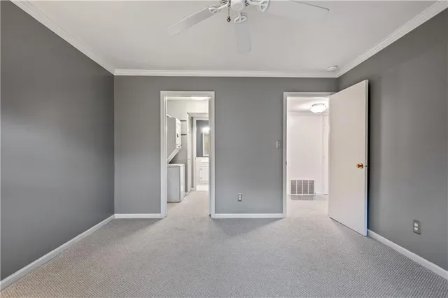 a utility room with closet dryer and washer