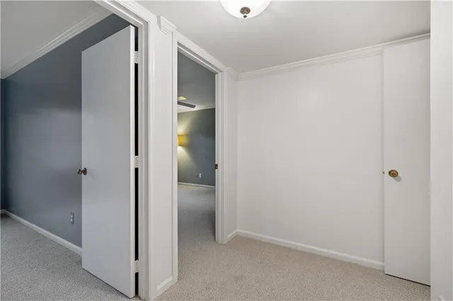 a view of an empty room and a window