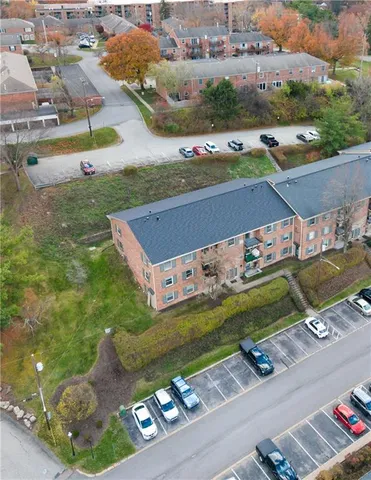 a front view of a house with parking