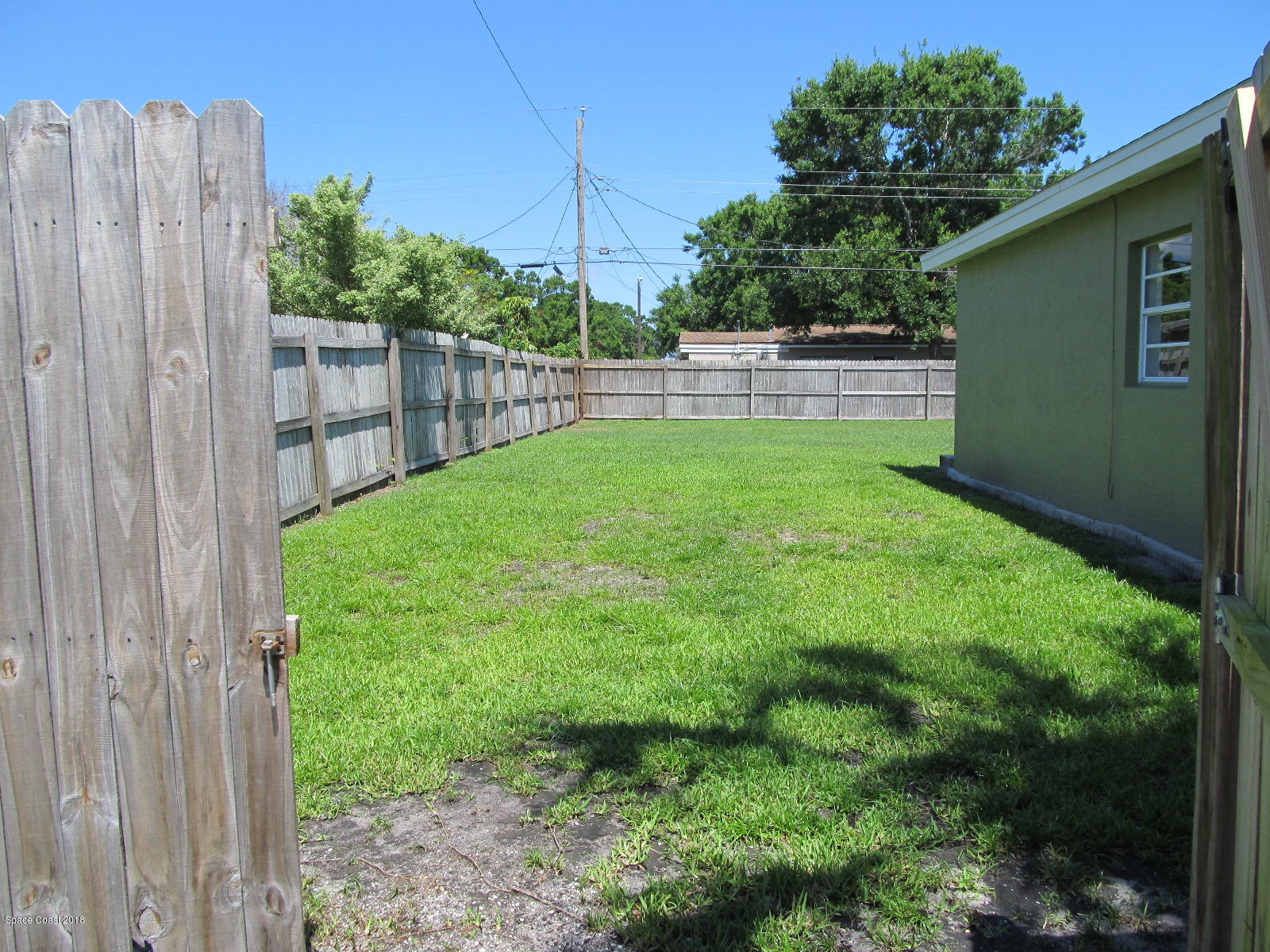 2358 Sarno Road Melbourne, FL 32935 - Photo 13 of 16 Double Gate to Backyard