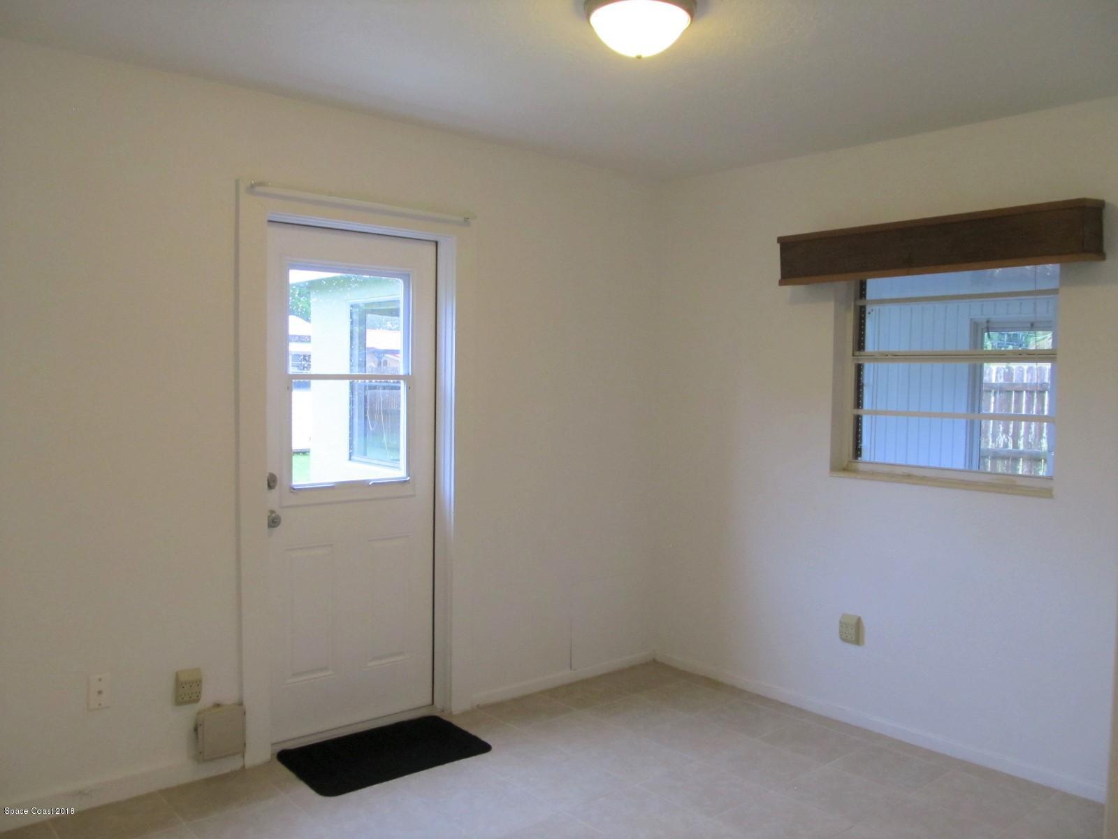 2358 Sarno Road Melbourne, FL 32935 - Photo 9 of 16 Second Bedroom has Exterior Door Access