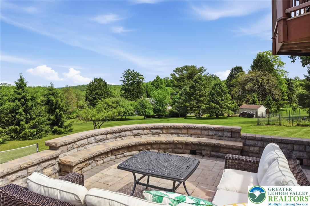 115 West Butternut Road Hellertown, PA 18055 - Photo 78 of 97 An inviting stone patio offers tranquil views of the verdant yard and distant rolling hills.