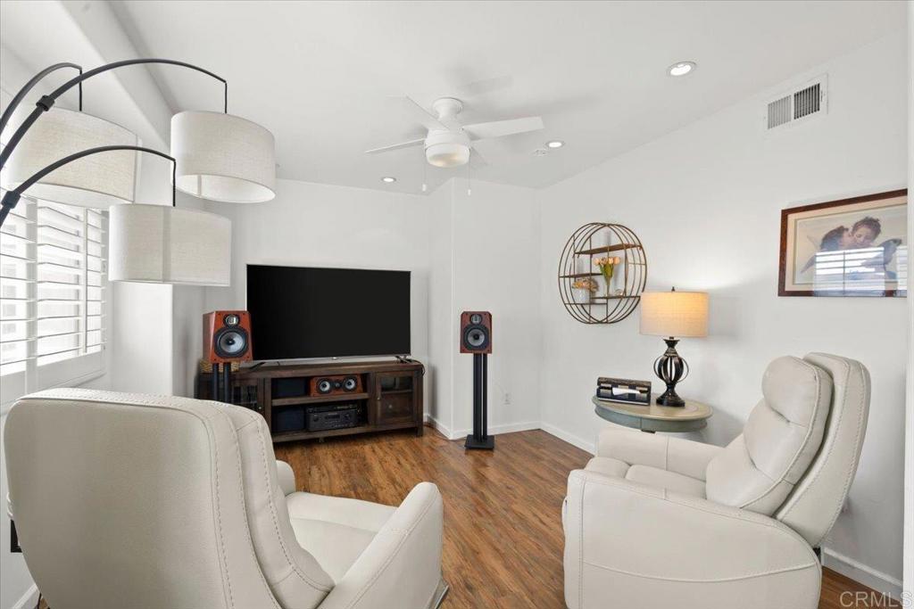 3069 West Canyon Avenue San Diego, CA 92123 - Photo 16 of 37 a living room with furniture and a flat screen tv