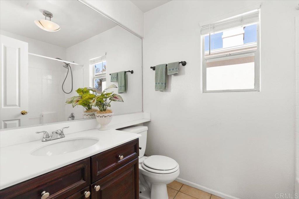 3069 West Canyon Avenue San Diego, CA 92123 - Photo 17 of 37 a bathroom with a sink toilet and a mirror