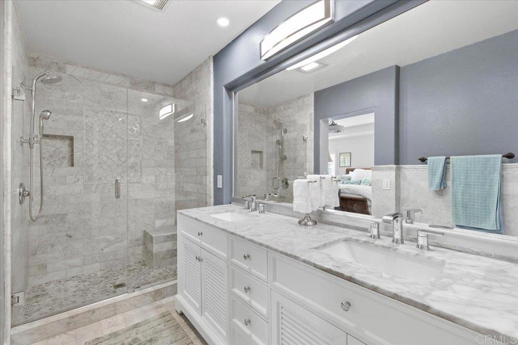 3069 West Canyon Avenue San Diego, CA 92123 - Photo 18 of 37 a bathroom with a granite countertop sink mirror and shower
