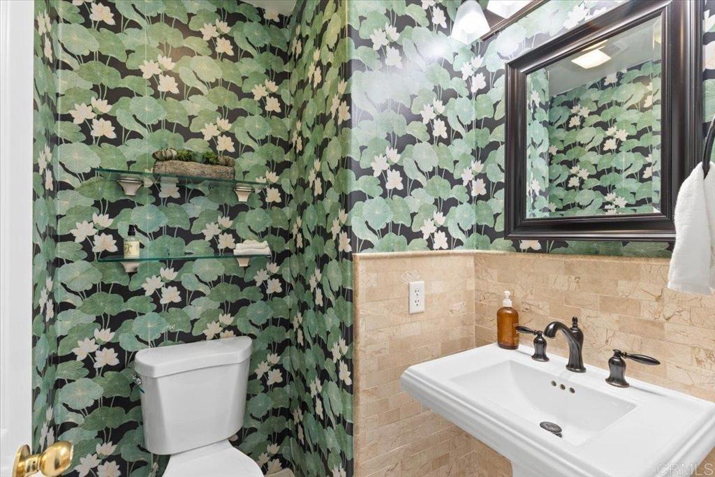 3069 West Canyon Avenue San Diego, CA 92123 - Photo 19 of 37 a bathroom with a sink mirror and toilet