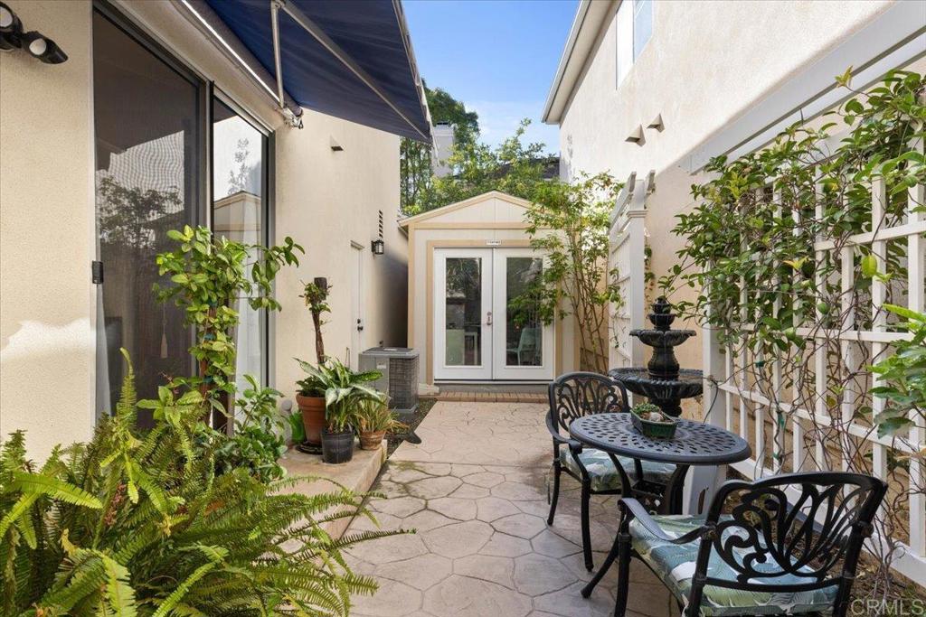 3069 West Canyon Avenue San Diego, CA 92123 - Photo 20 of 37 a view of a patio with table and chairs and potted plants