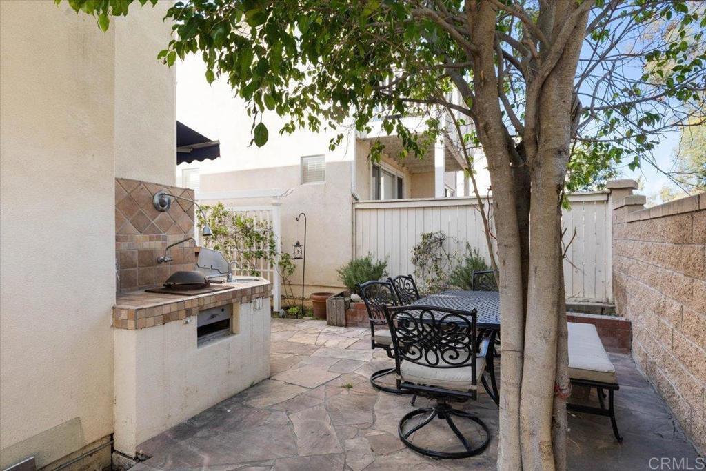 3069 West Canyon Avenue San Diego, CA 92123 - Photo 24 of 37 a balcony with furniture and potted plants