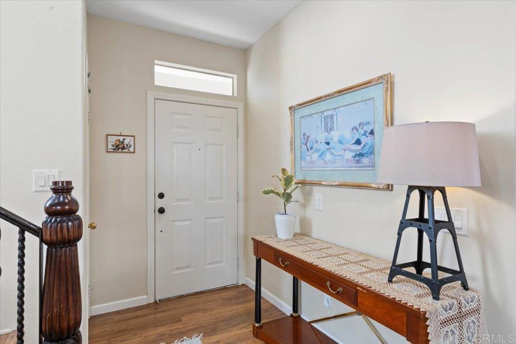 3069 West Canyon Avenue San Diego, CA 92123 - Photo 3 of 37 a view of a workspace with furniture and wooden floor
