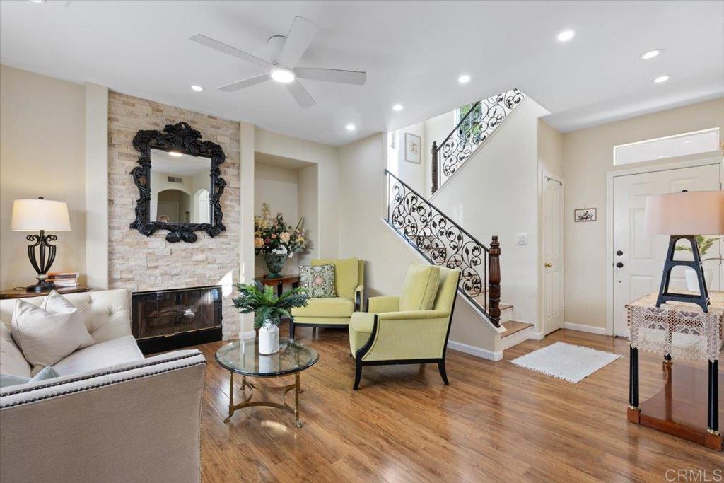 3069 West Canyon Avenue San Diego, CA 92123 - Photo 5 of 37 a living room with furniture and a fireplace
