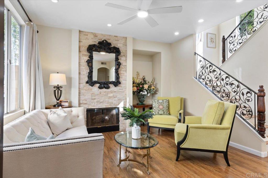 3069 West Canyon Avenue San Diego, CA 92123 - Photo 6 of 37 a living room with furniture and a fireplace