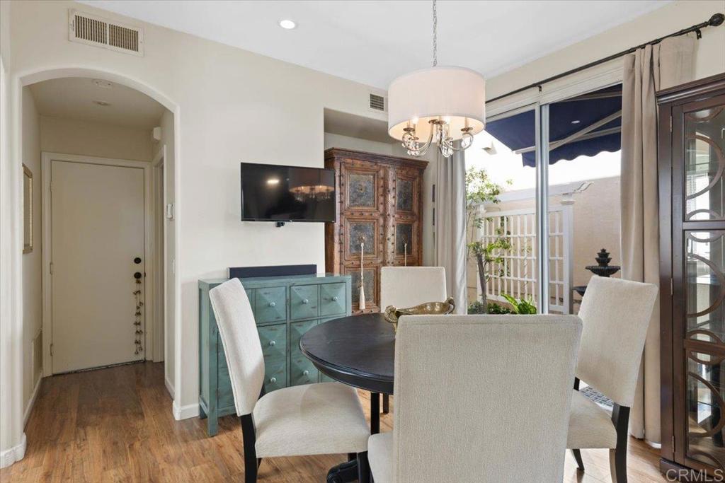 3069 West Canyon Avenue San Diego, CA 92123 - Photo 8 of 37 a view of a dining room with furniture window and wooden floor