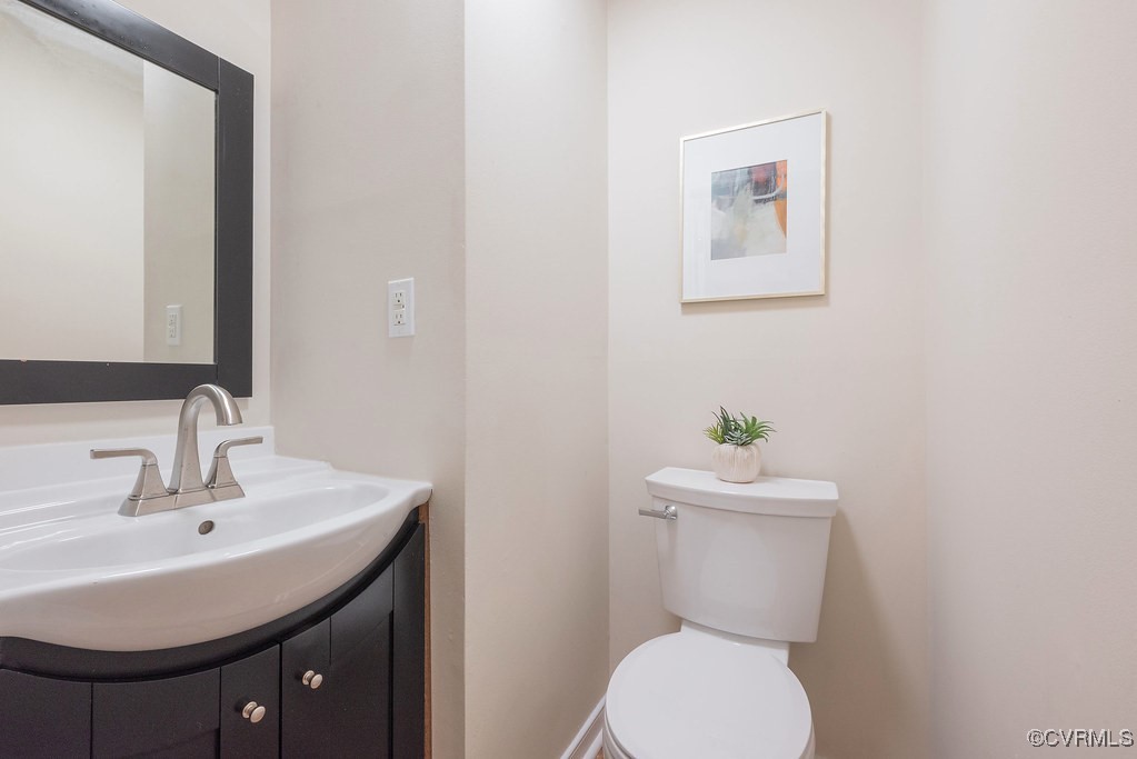 5003 Meredith Woods Road Glen Allen, VA 23060 - Photo 18 of 36 a bathroom with a toilet sink and mirror