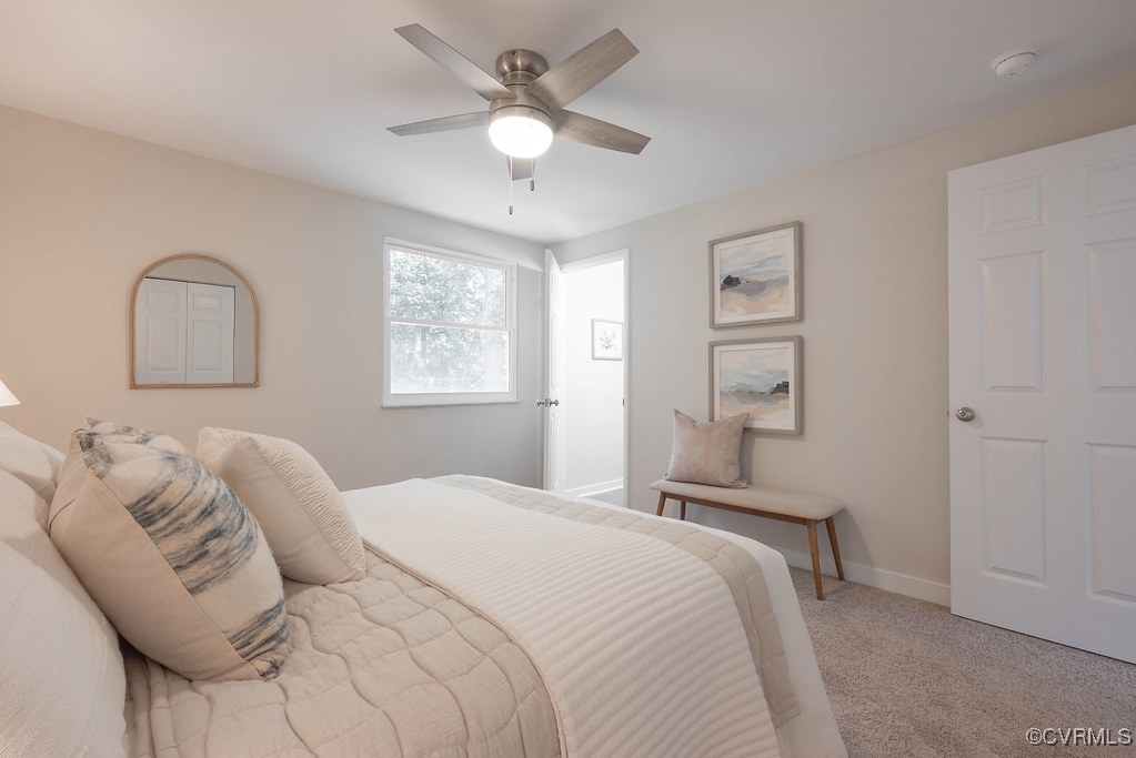 5003 Meredith Woods Road Glen Allen, VA 23060 - Photo 21 of 36 a bedroom with a bed and a chandelier