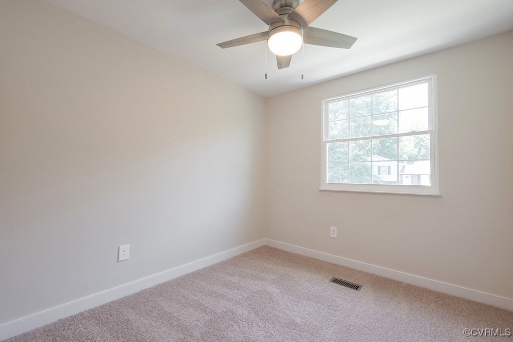 5003 Meredith Woods Road Glen Allen, VA 23060 - Photo 26 of 36 an empty room with a window and a fan