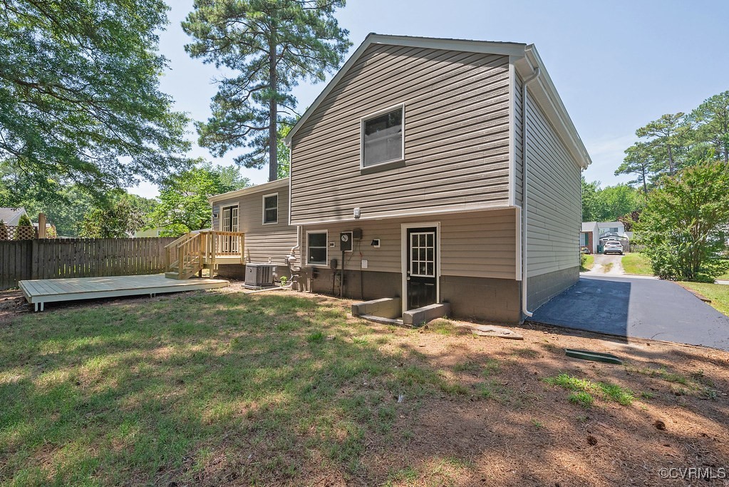 5003 Meredith Woods Road Glen Allen, VA 23060 - Photo 30 of 36 a view of a house with backyard and a tree