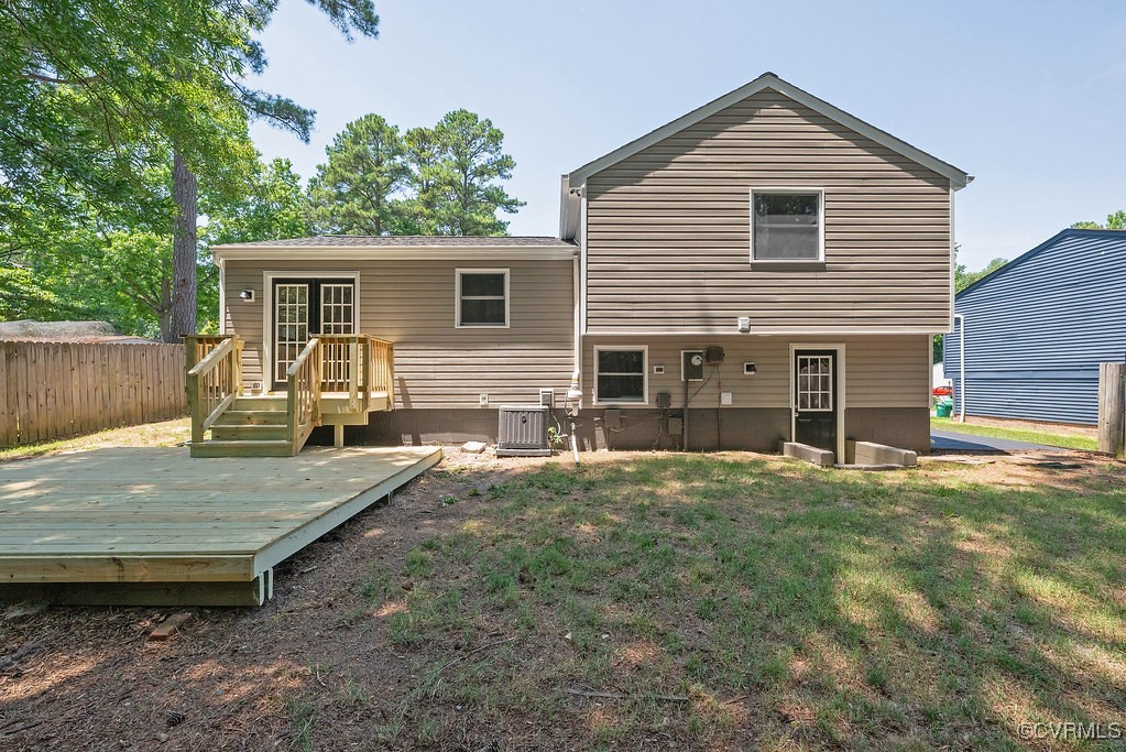 5003 Meredith Woods Road Glen Allen, VA 23060 - Photo 31 of 36 a view of a wooden house with a yard