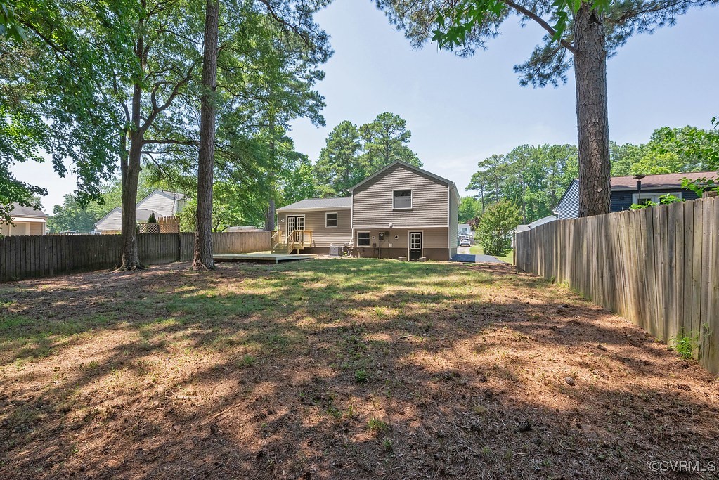 5003 Meredith Woods Road Glen Allen, VA 23060 - Photo 32 of 36 a view of a house with backyard and a tree