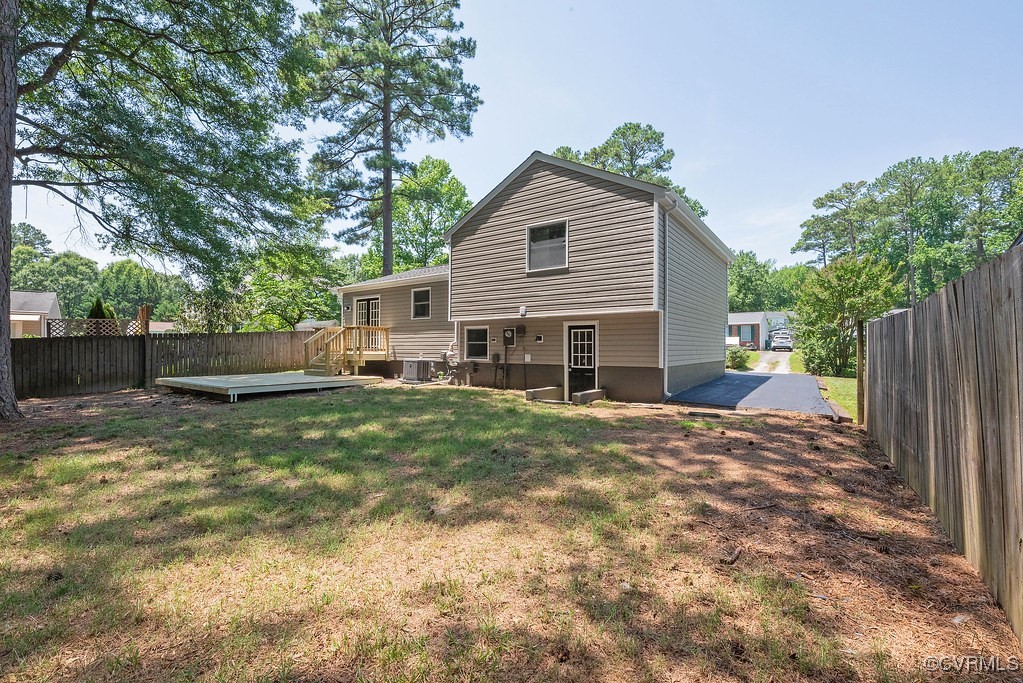 5003 Meredith Woods Road Glen Allen, VA 23060 - Photo 33 of 36 a view of a house with a yard and a large tree