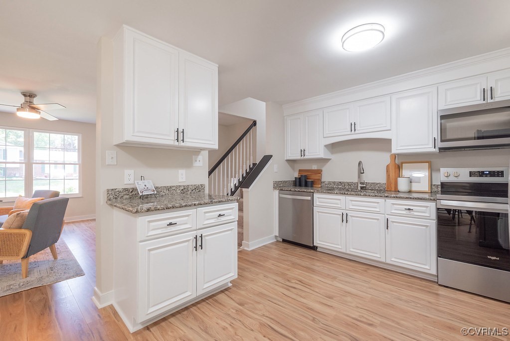 5003 Meredith Woods Road Glen Allen, VA 23060 - Photo 5 of 36 a kitchen with granite countertop white cabinets and white appliances