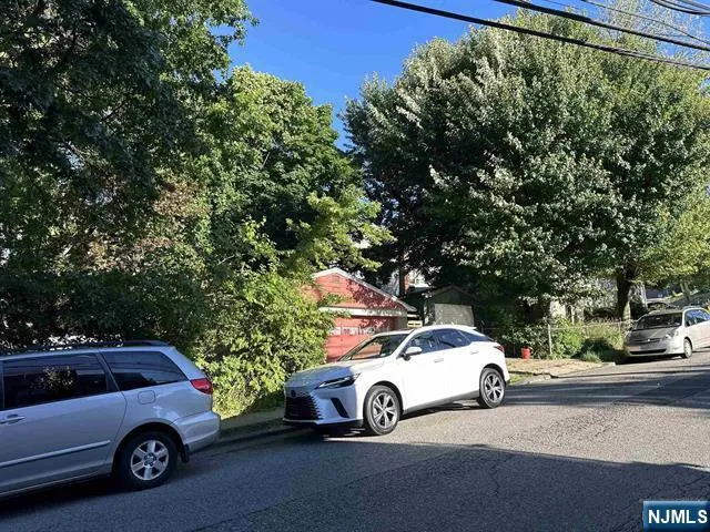 a view of a car parked in front of a house