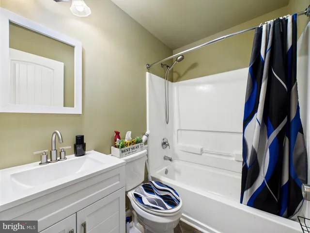 a bathroom with a sink a toilet and a bathtub