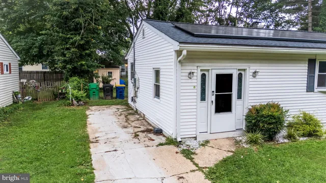 a view of a bird house next to a yard