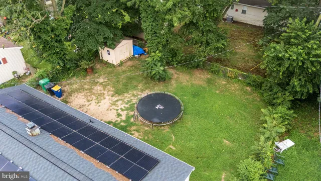 a view of a back yard from a balcony