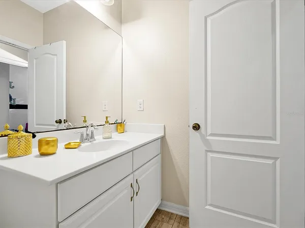 a bathroom with a sink and a mirror