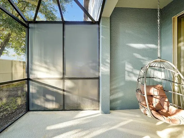 a bathroom with a glass shower door and a window