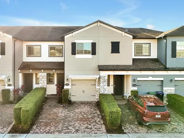 a aerial view of a house with swimming pool and sitting area