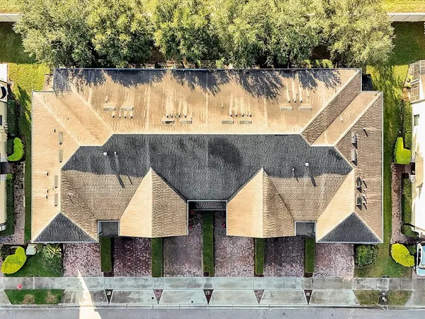 an aerial view of a house with a swimming pool