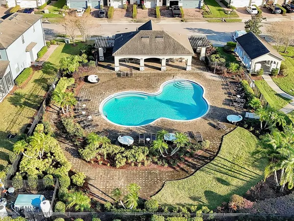 a aerial view of a house with swimming pool and ocean view