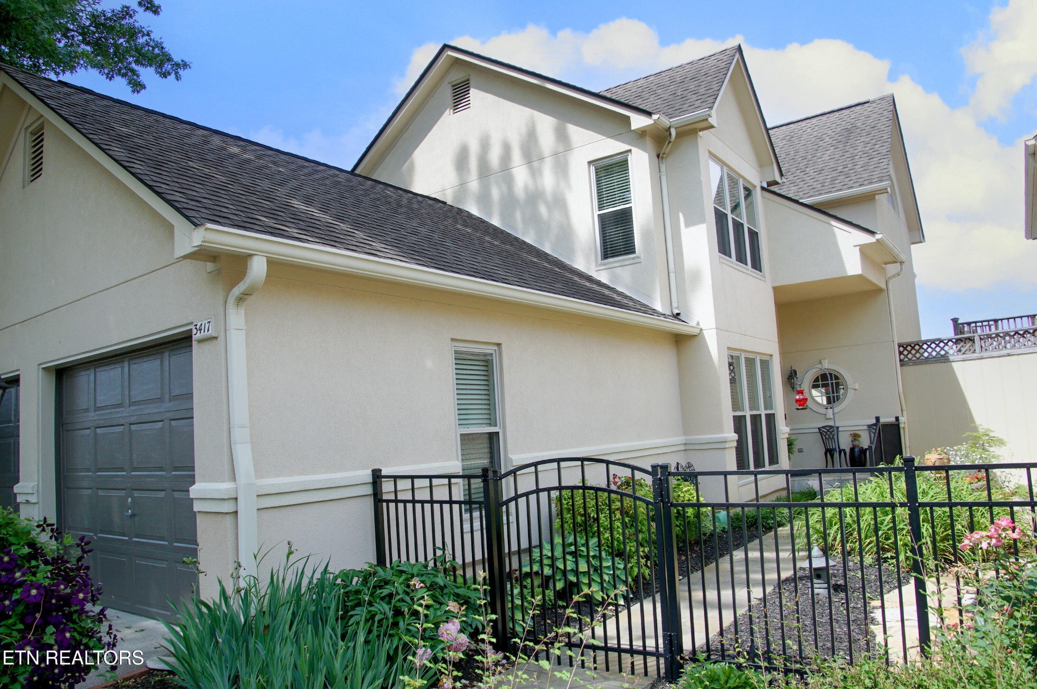 3417 Commodore Point Knoxville, TN 37922 - Photo 1 of 31 a view of a house with a small yard and plants