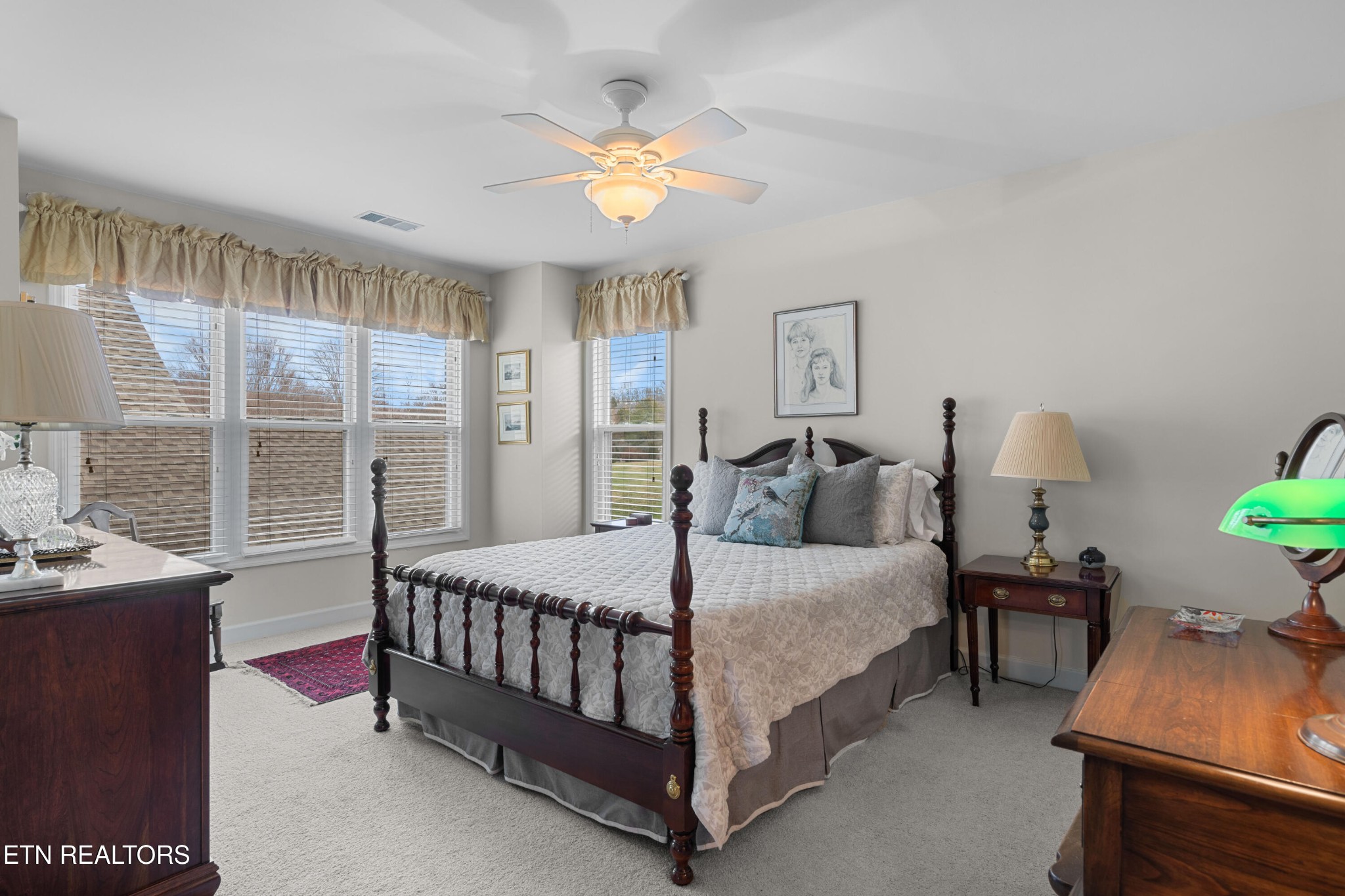 3417 Commodore Point Knoxville, TN 37922 - Photo 19 of 31 a bedroom with a bed and a chandelier