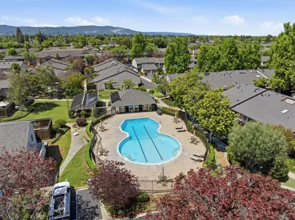 a view of outdoor space with swimming pool and seating