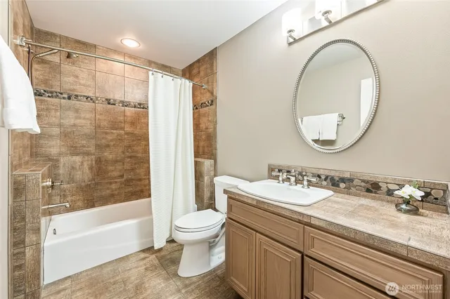 a living room with furniture a rug and a large window
