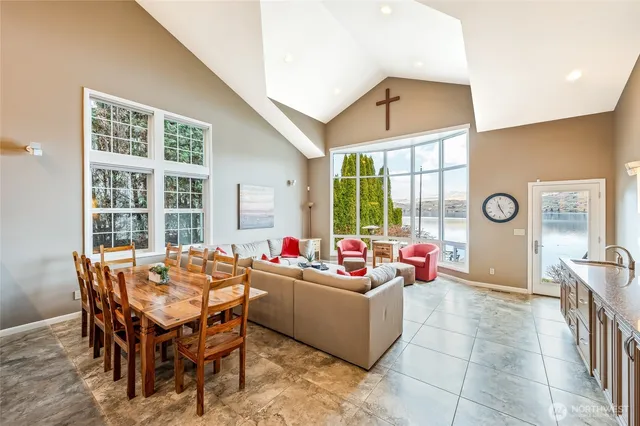 a living room with furniture or outdoor view and a large window