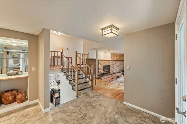 a living room with furniture windows and a fireplace