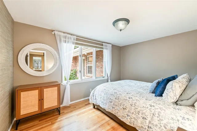 a bedroom with a bed and dresser