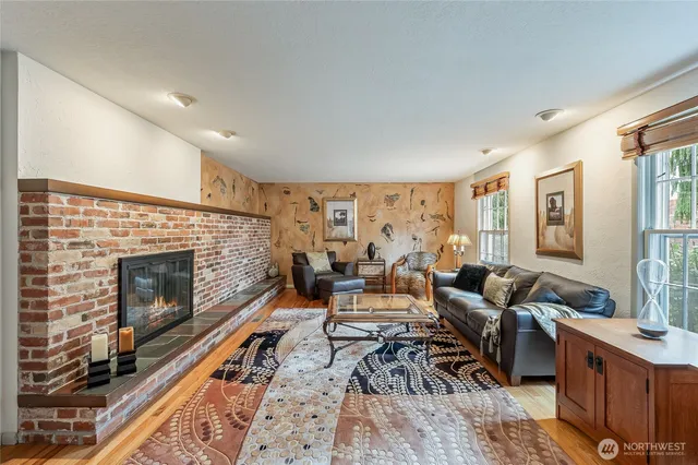 a bathroom with a sink a toilet and a large mirror