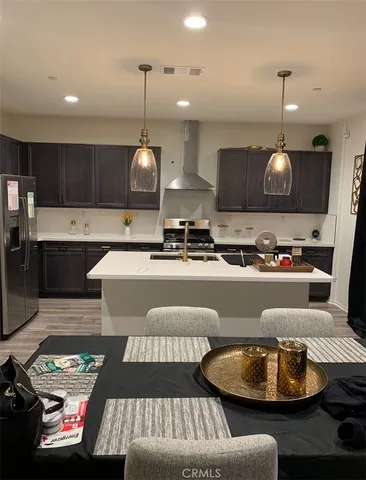 a kitchen with counter space and a living room view