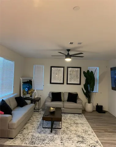 a living room with furniture and a rug