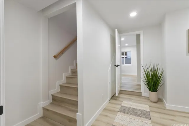 a view of entryway with wooden floor and potted plant