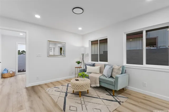 a living room with furniture and window