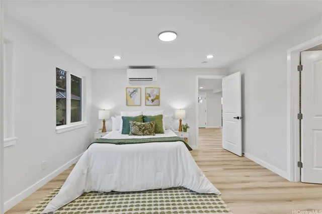 a bedroom with a large bed and a window