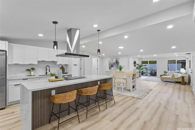 a large kitchen with a table and chairs