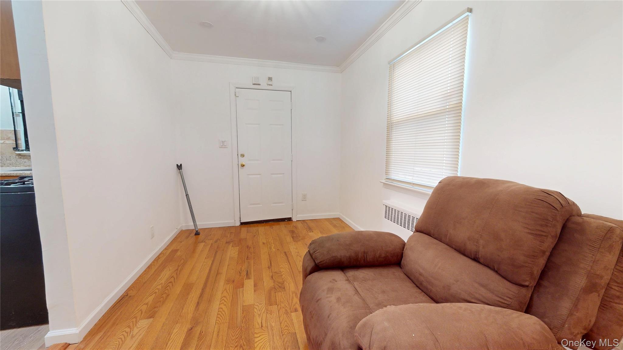 219-42 141st Road Queens, NY 11413 - Photo 15 of 23 a bedroom with a bed and a window