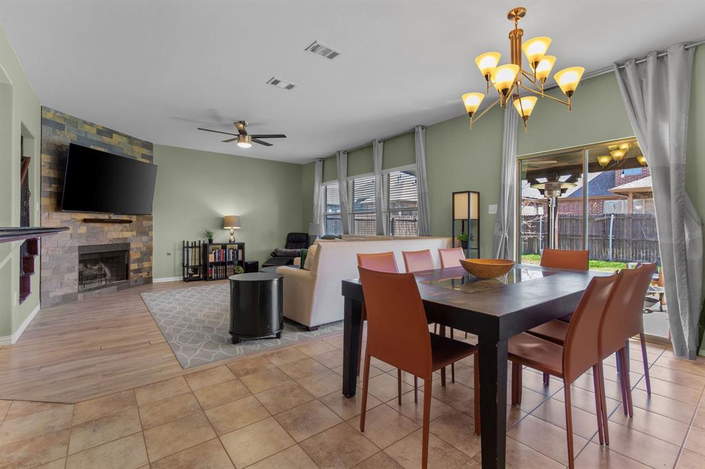 3213 Evening Wind Road Denton, TX 76208 - Photo 27 of 28 This open floor plan offers dining area, living room, and kitchen all in one area making it great for entertaining.